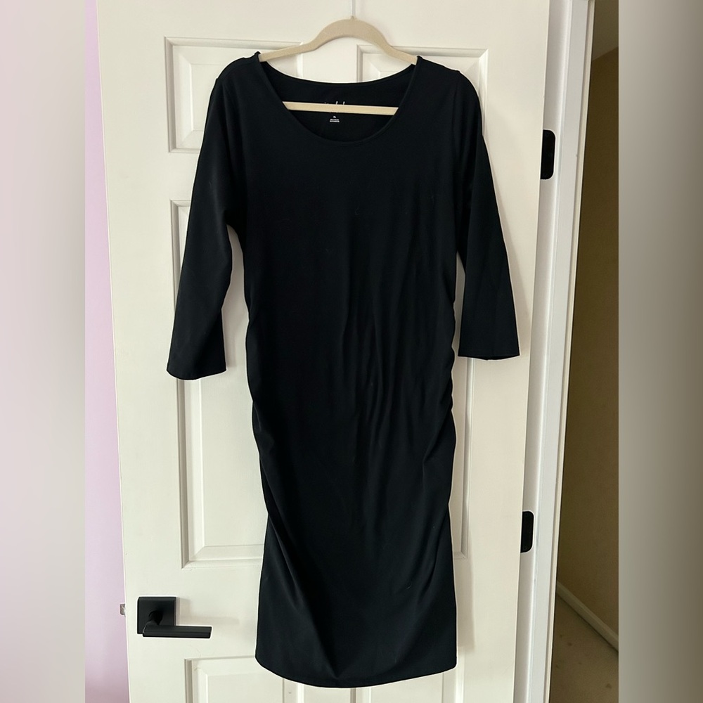 Long sleeve, maternity, stretch, body hugging dress.